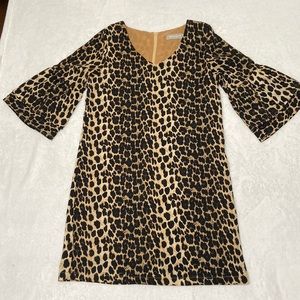 Small cheetah print dress with flared sleeves zipper and slip underneath